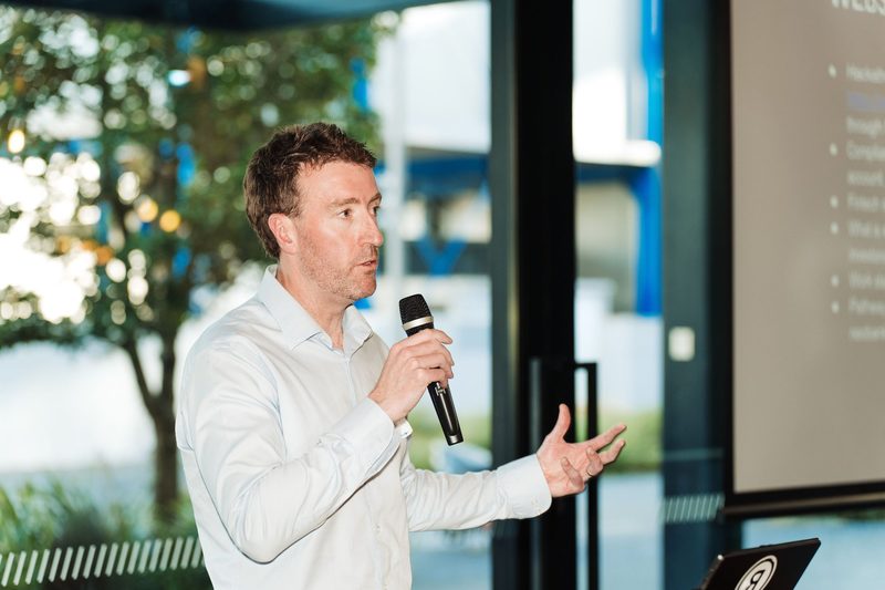 Kevin Whitmore speaking at a technology conference